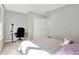 Bedroom with a full sized bed, large window, and a desk under the window at 7111 Lillian Pl, Cumberland, IN 46229