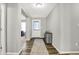 Welcoming entryway featuring wood-look floors, a stylish accent rug, and a decorative table at 7111 Lillian Pl, Cumberland, IN 46229