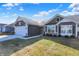 Inviting one-story home with neat lawn, lovely landscaping, and a convenient two-car garage at 7111 Lillian Pl, Cumberland, IN 46229