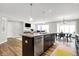Spacious eat-in kitchen features a center island with a sink and stainless steel dishwasher at 7111 Lillian Pl, Cumberland, IN 46229