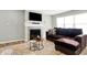 Cozy living room featuring a fireplace, a plush couch and neutral tones at 7111 Lillian Pl, Cumberland, IN 46229