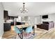 Open floor plan features kitchen, dining, and living areas with ample natural light at 7111 Lillian Pl, Cumberland, IN 46229