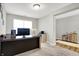 Comfortable office area with natural light, ample desk space, and calming, neutral decor at 7111 Lillian Pl, Cumberland, IN 46229