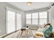 Bright sitting area features a modern sofa, patterned rug, and lots of natural light at 7111 Lillian Pl, Cumberland, IN 46229