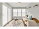 Bright sitting area features a modern sofa, patterned rug, and lots of natural light at 7111 Lillian Pl, Cumberland, IN 46229