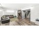 Spacious basement with a brick fireplace, comfortable seating area and stairs leading upstairs at 7138 Avalon Trail Ct, Indianapolis, IN 46250