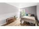 Comfortable bedroom with hardwood floors, natural light, and ample space at 7138 Avalon Trail Ct, Indianapolis, IN 46250