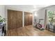 Bright bedroom with hardwood floors, lots of closet space and a large window bringing in natural light at 7138 Avalon Trail Ct, Indianapolis, IN 46250