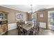Elegant dining room with hardwood floors, ample seating, and traditional decor at 7138 Avalon Trail Ct, Indianapolis, IN 46250