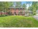 Attractive two-story brick home with manicured lawn and mature plantings at 7138 Avalon Trail Ct, Indianapolis, IN 46250