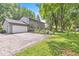Charming home featuring an attached garage, a spacious driveway, and lush landscaping at 7138 Avalon Trail Ct, Indianapolis, IN 46250