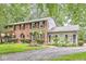 Charming brick two-story home with black shutters and manicured landscaping at 7138 Avalon Trail Ct, Indianapolis, IN 46250