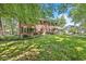 Well-maintained two-story brick house with lush lawn and mature trees at 7138 Avalon Trail Ct, Indianapolis, IN 46250