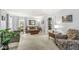 Cozy living room featuring carpet, a comfortable sofa, and natural light at 7138 Avalon Trail Ct, Indianapolis, IN 46250