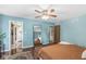 Spacious primary bedroom with hardwood floors, cool wall color, and ensuite bathroom at 7138 Avalon Trail Ct, Indianapolis, IN 46250
