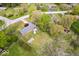 An aerial view of a single-Gathering home with a grey roof, well-kept lawn, garden, and a privacy fence in the backyard at 7263 Hidden Valley Dr, Plainfield, IN 46168