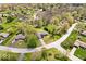 Aerial view showcasing the house, its surrounding neighborhood, and lush greenery from above at 7263 Hidden Valley Dr, Plainfield, IN 46168