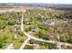 Wide aerial shot capturing the neighborhood's serene setting with lush tree coverage and well-spaced homes at 7263 Hidden Valley Dr, Plainfield, IN 46168