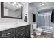 Stylish bathroom featuring a dark vanity, bright mirror and updated fixtures for a sleek modern look at 7263 Hidden Valley Dr, Plainfield, IN 46168