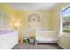 Cheerful Bedroom with yellow walls, plush carpet, and a window providing natural light and views at 7263 Hidden Valley Dr, Plainfield, IN 46168