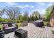 Inviting backyard deck with outdoor furniture and grill perfect for relaxation and entertaining at 7263 Hidden Valley Dr, Plainfield, IN 46168