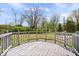 Spacious wooden deck with railing, providing a cozy outdoor space to enjoy the yard's view at 7263 Hidden Valley Dr, Plainfield, IN 46168