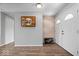 Inviting foyer with wood-look flooring, a picture gallery, and a brightly lit front door entrance at 7263 Hidden Valley Dr, Plainfield, IN 46168