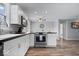 Spacious eat-in kitchen with stainless steel appliances, a breakfast bar, and wood floors at 7263 Hidden Valley Dr, Plainfield, IN 46168