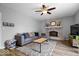 Cozy living room with comfortable seating, a decorative fireplace, and a warm and inviting atmosphere at 7263 Hidden Valley Dr, Plainfield, IN 46168