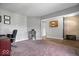 Spacious living room with stylish decor, plush carpet, and ample space for comfortable seating and relaxation at 7263 Hidden Valley Dr, Plainfield, IN 46168