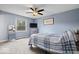 Relaxing blue bedroom features a ceiling fan, blue accents, and carpet flooring at 7263 Hidden Valley Dr, Plainfield, IN 46168