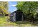 Exterior shot of a well-maintained backyard shed with storage space and garden features at 7263 Hidden Valley Dr, Plainfield, IN 46168