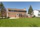 The backyard showcases a well-maintained lawn and an inviting deck area, perfect for enjoying the outdoors at 8259 Plumwood Ln, Indianapolis, IN 46256