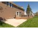 A spacious backyard features a concrete patio, a deck with railings, and lush green grass perfect for outdoor activities at 8259 Plumwood Ln, Indianapolis, IN 46256