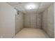 Unfinished basement with concrete walls, tile flooring, and a small window, ready for customization at 8259 Plumwood Ln, Indianapolis, IN 46256