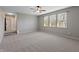 Spacious bedroom featuring a large window and plush carpeting at 8259 Plumwood Ln, Indianapolis, IN 46256