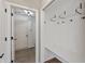 Entryway area that includes a closet with shelving and hooks for storage at 8259 Plumwood Ln, Indianapolis, IN 46256