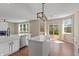 Open kitchen and dining area with modern appliances and plenty of natural light at 8259 Plumwood Ln, Indianapolis, IN 46256