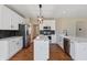 Stylish kitchen with white cabinets, stainless steel appliances, and a center island at 8259 Plumwood Ln, Indianapolis, IN 46256