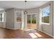 Bright living room featuring hardwood floors and sliding glass doors to an outdoor deck at 8259 Plumwood Ln, Indianapolis, IN 46256