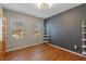 Minimalist office with a shelf and two windows providing natural light at 8259 Plumwood Ln, Indianapolis, IN 46256