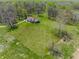Aerial view of a secluded property featuring a large manicured lawn and mature trees providing a serene setting at 8654 N Baltimore Rd, Monrovia, IN 46157