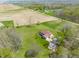 A high angle aerial view featuring the property with a large yard and a long driveway leading to the house at 8654 N Baltimore Rd, Monrovia, IN 46157