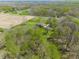 Aerial shot showcases a home embraced by a mix of dense forest and open fields, offering a private retreat at 8654 N Baltimore Rd, Monrovia, IN 46157