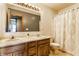 Well-lit bathroom with double vanity and a shower/tub combo at 8654 N Baltimore Rd, Monrovia, IN 46157