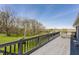 Spacious wooden deck with railing overlooking the yard at 8654 N Baltimore Rd, Monrovia, IN 46157