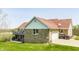 Exterior view of the house with a deck, walk out basement and garage at 8654 N Baltimore Rd, Monrovia, IN 46157