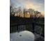 Outdoor patio with seating offering scenic views of the trees during sunset at 8654 N Baltimore Rd, Monrovia, IN 46157