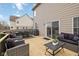 Outdoor patio with a table, grill, comfortable wicker furniture, and a sliding glass door at 8834 Pin Oak Dr, Zionsville, IN 46077
