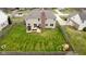Expansive backyard with deck, grill, and play set at 8834 Pin Oak Dr, Zionsville, IN 46077